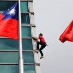 American rock climber Alex Honnold reaches top of Taipei 101 skyscraper without ropes