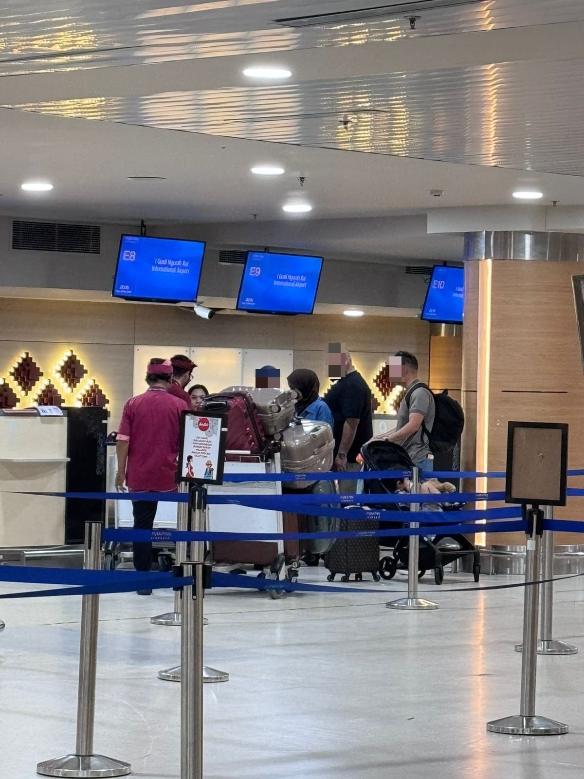 Immigration officers holds family at exit baggage